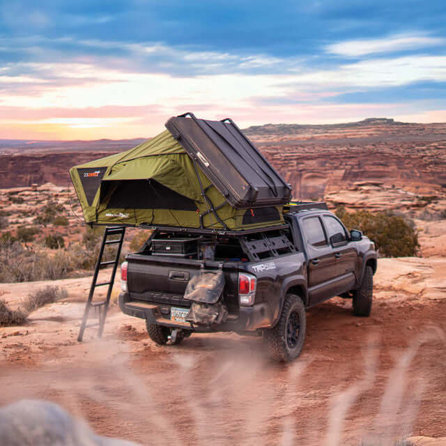 23Zero Armadillo AX3 roof top tent setup on a truck in a scenic outdoor landscape.