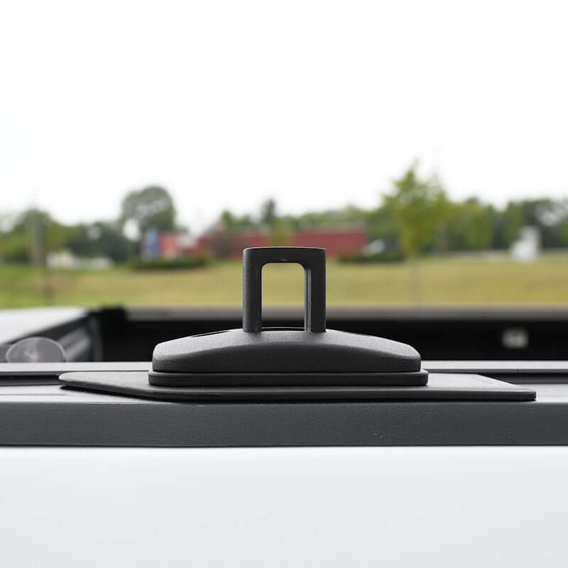 Close-up of Putco black stake pocket tie-down anchor for pickup trucks, ideal for securing cargo.