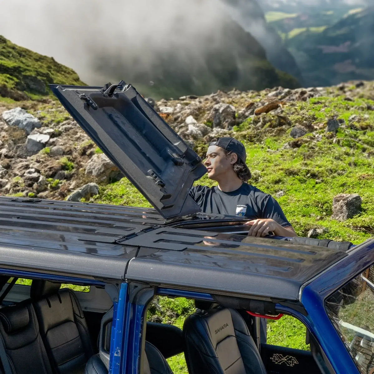 Jeep JT Gladiator Freedom Panel storage with flip-top feature being demonstrated outdoors.