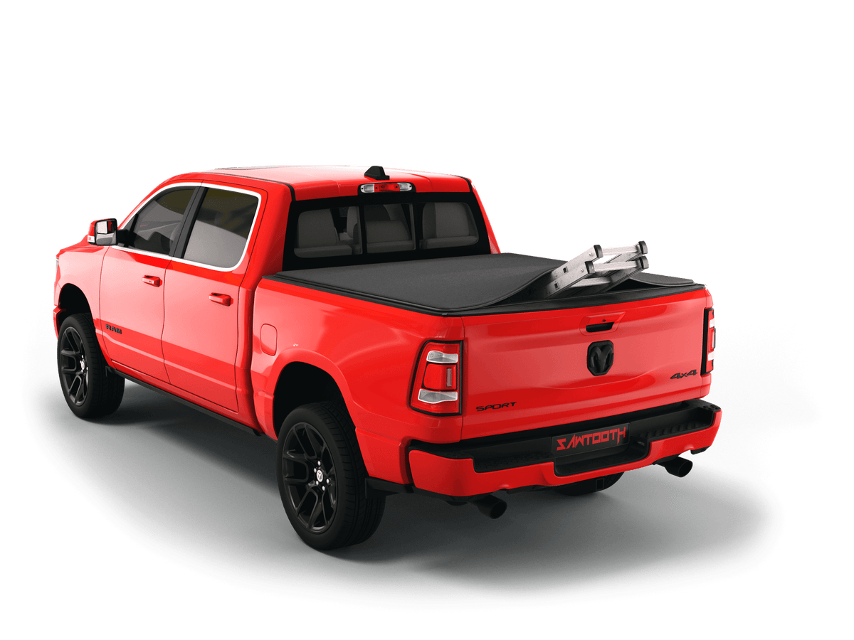 Red Ram 1500 with ladder sticking out of Sawtooth Stretch expandable truck bed cover