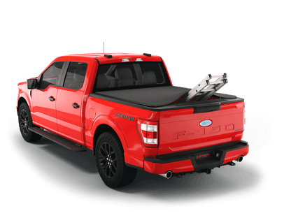Red Ford F-150 with ladder sticking out of Sawtooth Stretch expandable truck bed cover