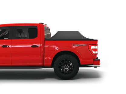 Red Ford F-150 with Sawtooth Stretch tonneau cover expanded over cargo load