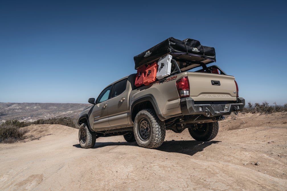 Body Armor Pro Series Rear Bumper - Textured Black Powder-Coated Steel - Fits 2016-2023 Toyota Tacoma (With D-Rings, Light Cutouts, License Plate Mount)