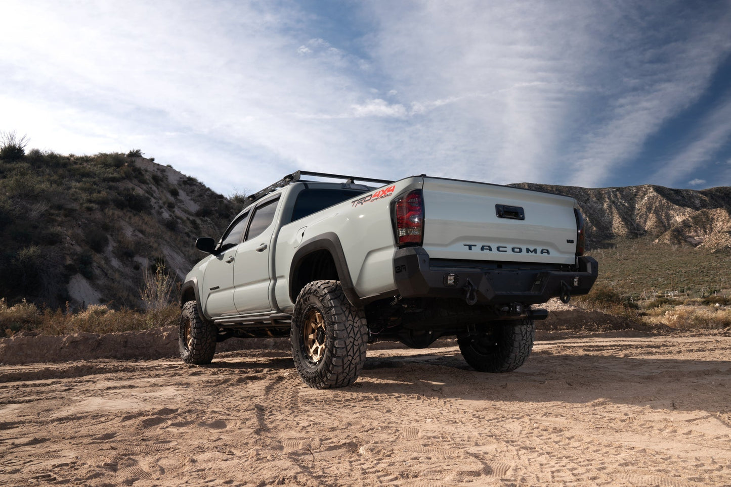 Body Armor Pro Series Rear Bumper - Textured Black Powder-Coated Steel - Fits 2016-2023 Toyota Tacoma (With D-Rings, Light Cutouts, License Plate Mount)