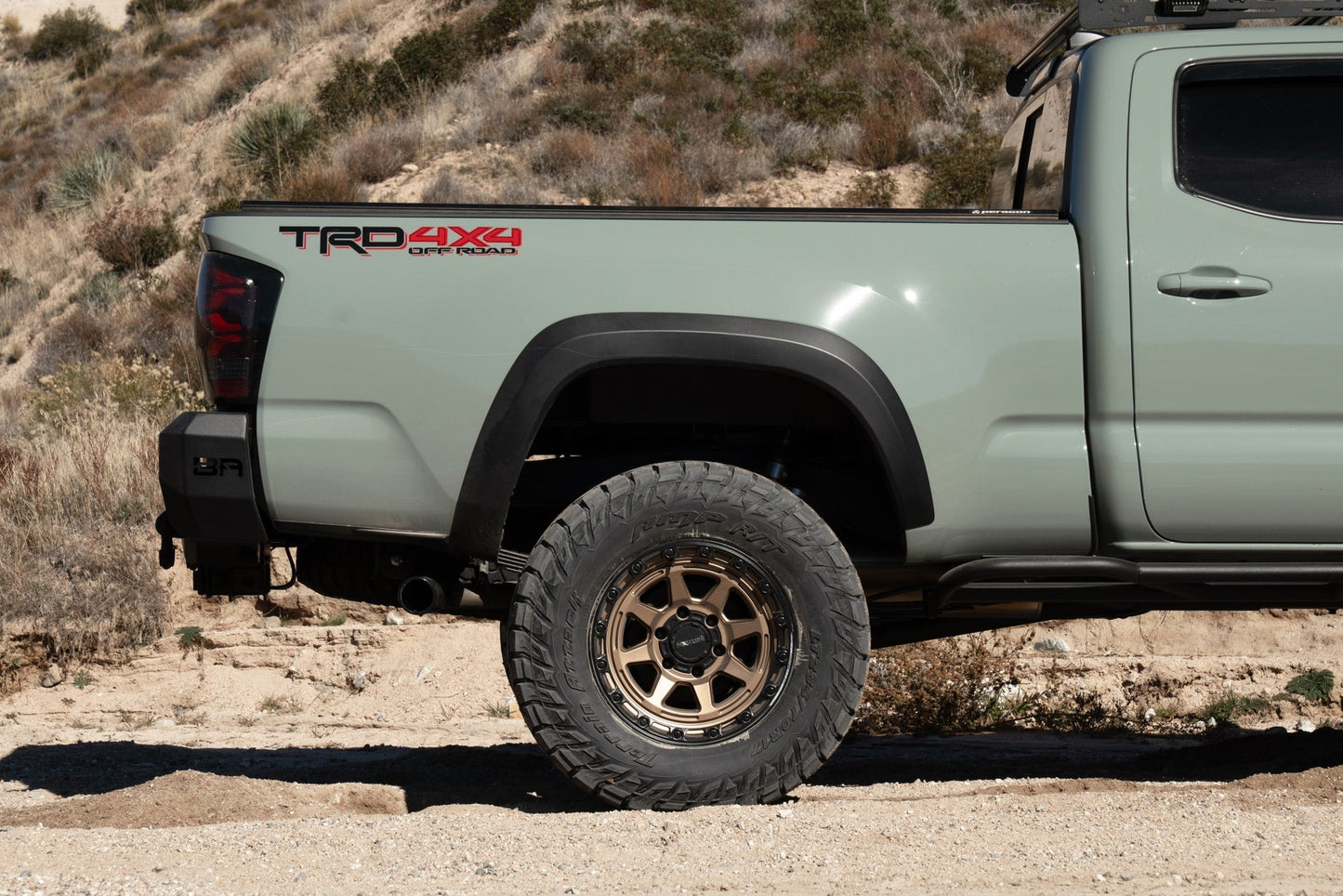 Body Armor Pro Series Rear Bumper - Textured Black Powder-Coated Steel - Fits 2016-2023 Toyota Tacoma (With D-Rings, Light Cutouts, License Plate Mount)