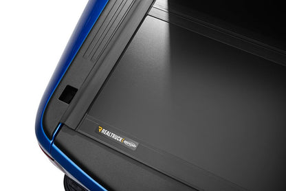 UnderCover Ultra Flex Hard Folding Tonneau Cover 5'7" Fits 2019-25 Ram 1500 (New Body Style) w/o RamBox and w/o Multifunction Tailgate