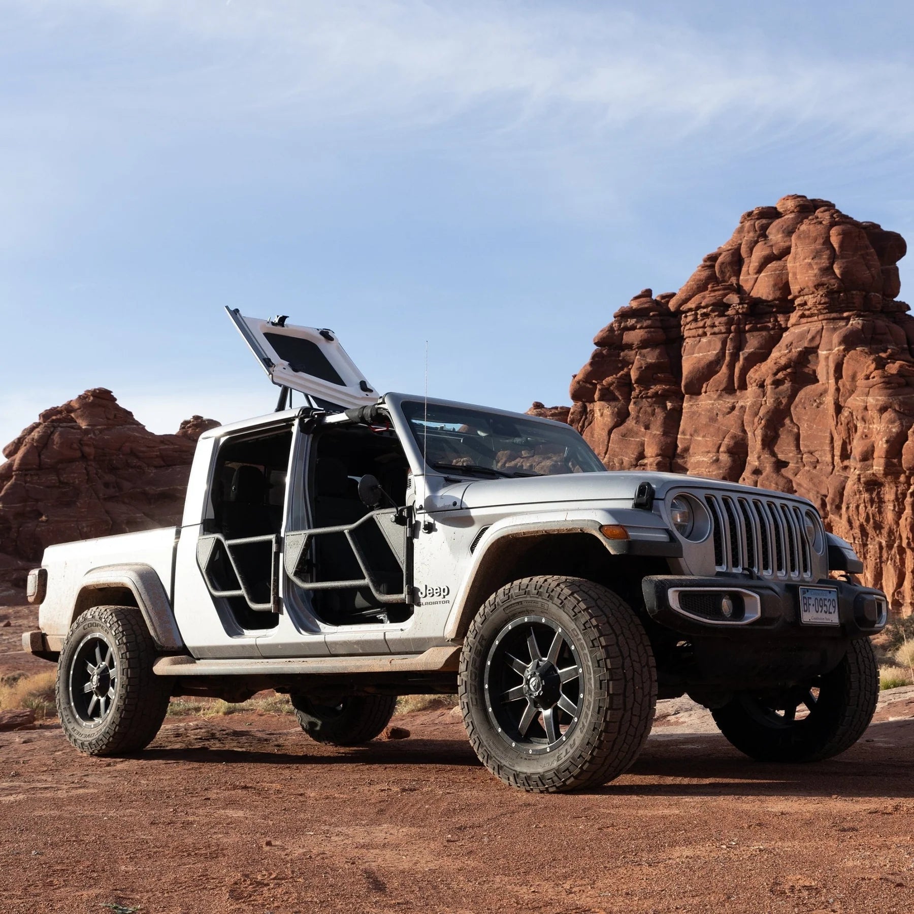 Jeep JT Gladiator Freedom Panel storage with open roof panels in a rocky landscape.