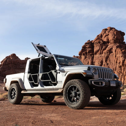 Jeep JT Gladiator Freedom Panel storage with open roof panels in a rocky landscape.
