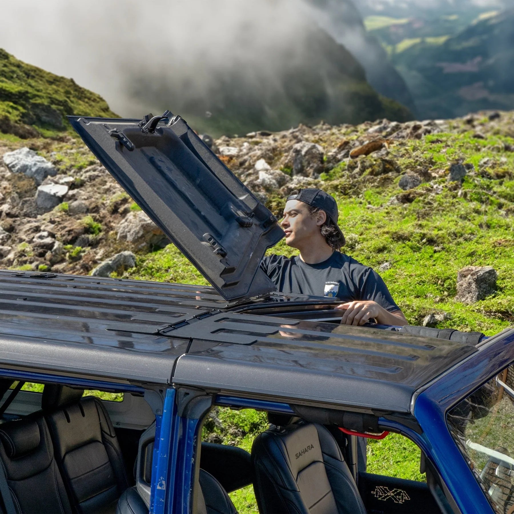 Jeep JT Gladiator Freedom Panel storage with flip-top feature being demonstrated outdoors.