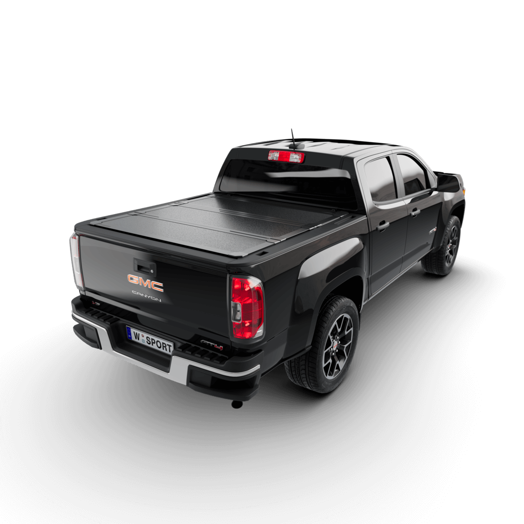 hard aluminum tonneau cover for Chevrolet Colorado on a black GMC Canyon truck from the rear view.