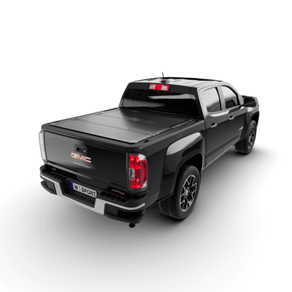 hard aluminum tonneau cover for Chevrolet Colorado on a black GMC Canyon truck from the rear view.