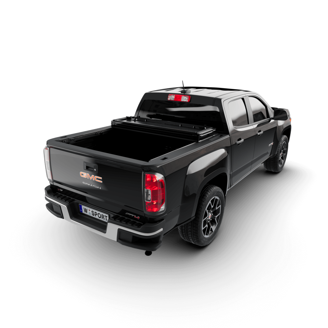hard aluminum tonneau cover for Chevrolet Colorado shown on black GMC Canyon truck from rear view.