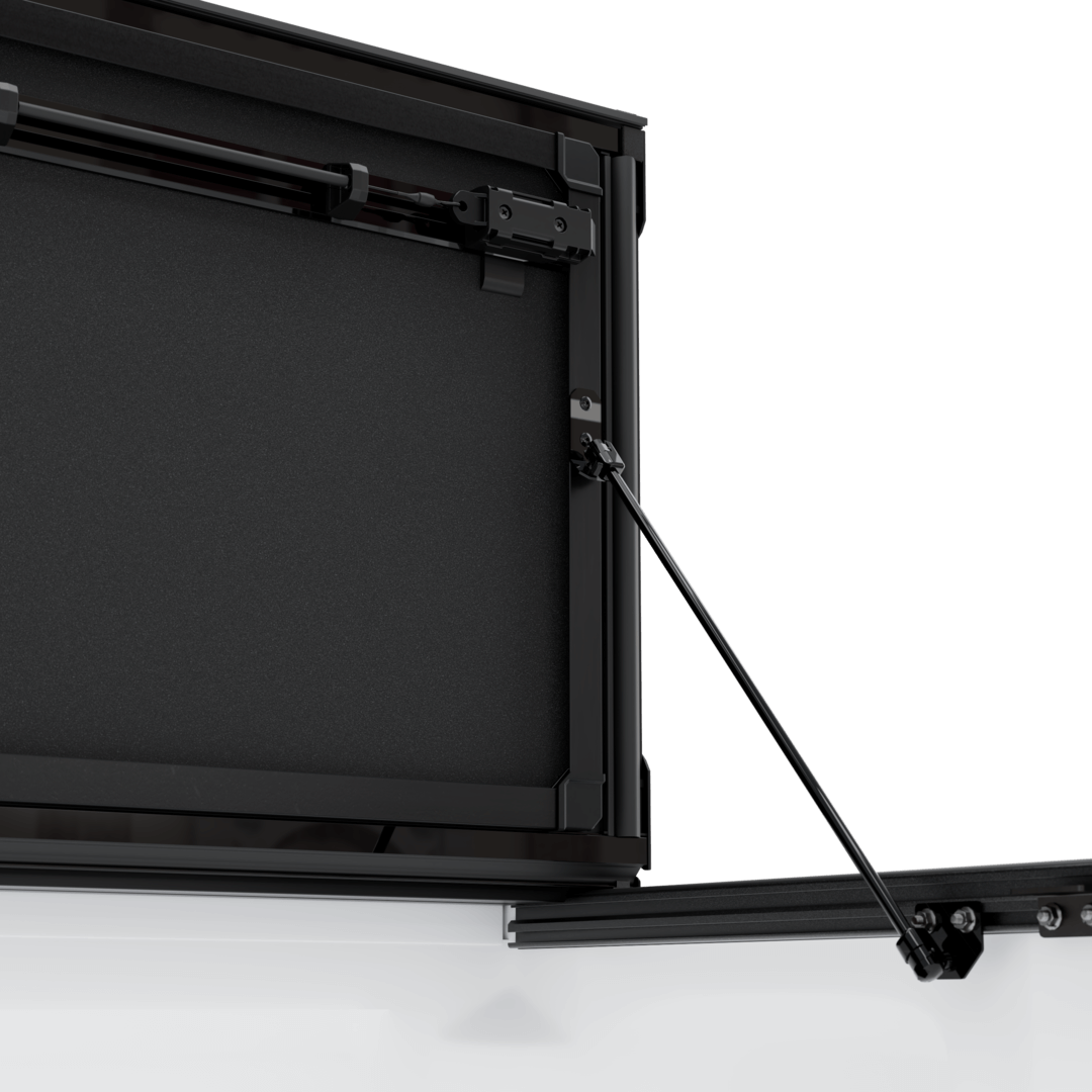 hard aluminum tonneau cover for Chevrolet Colorado showing hinge and support mechanism.