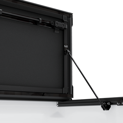 hard aluminum tonneau cover for Chevrolet Colorado showing hinge and support mechanism.