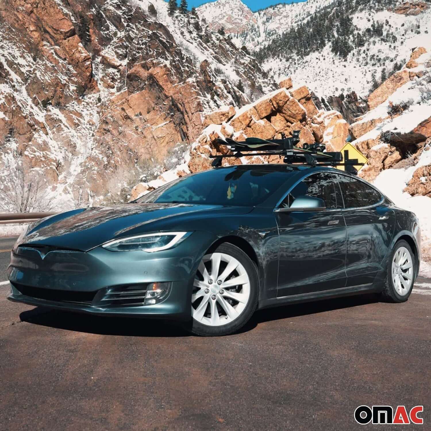 Mercedes E-Class roof rack cross bars installed on a car in a scenic mountainous area.