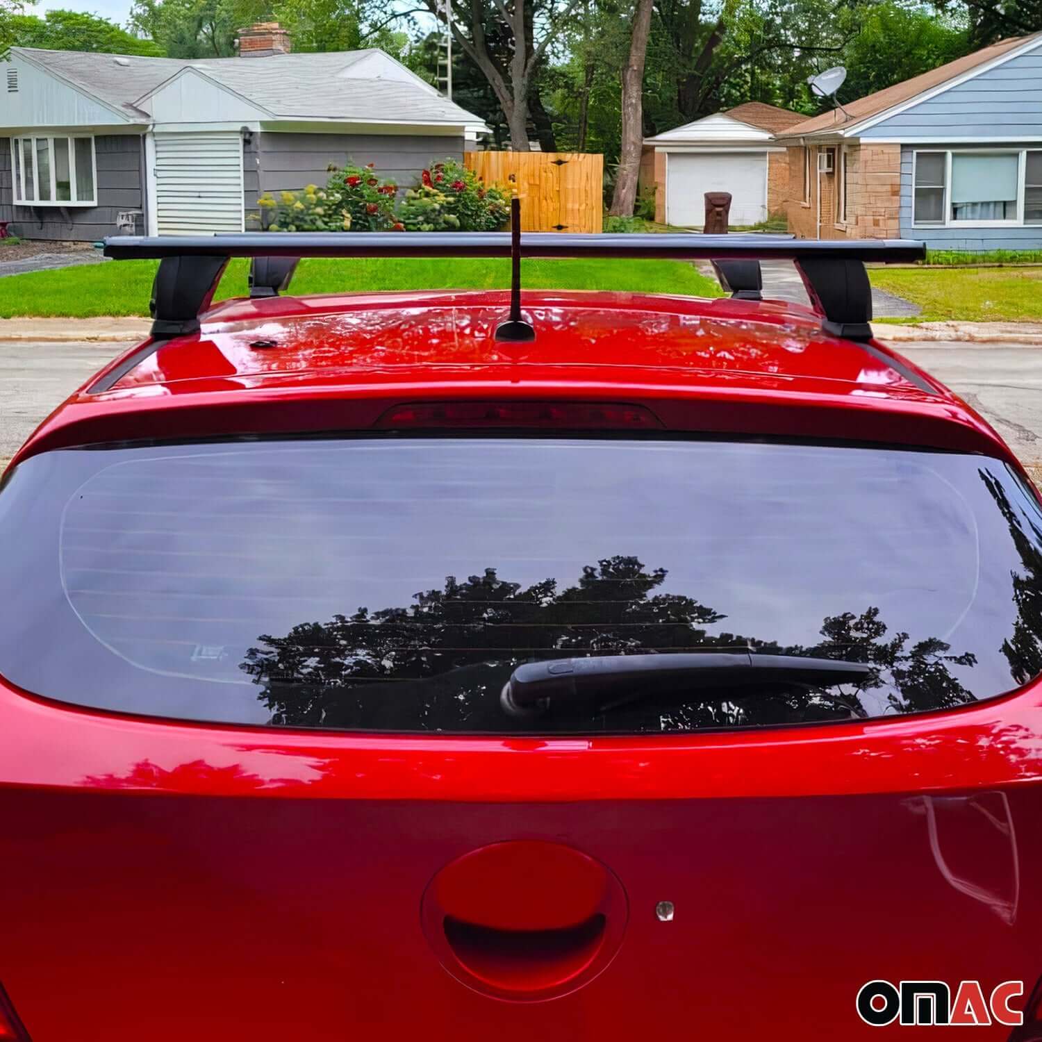 Mercedes E-Class roof rack cross bars installed on a red sedan, showcasing sturdy aluminum design.