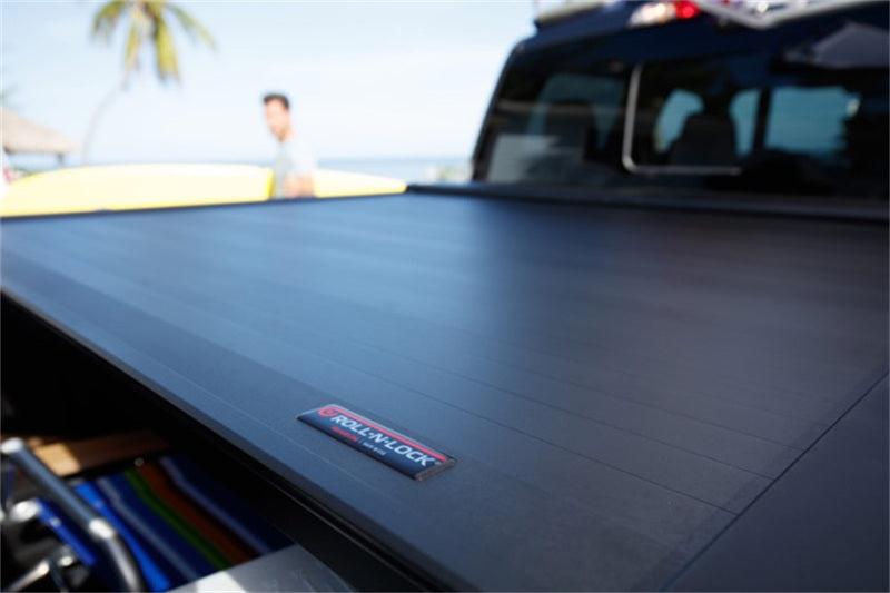 ROLL-N-LOCK E-Series Hard Power Retractable Tonneau Cover 67.4 In. Fits 2019-24 Ram 1500 No RamBox