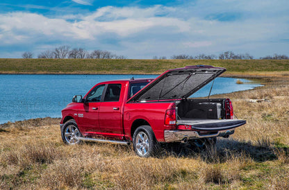 UNDERCOVER Elite LX Painted Hard Tilt-Up Tonneau Cover 5'7" Fits 2019-24 Ram - Velvet Red Pearl
